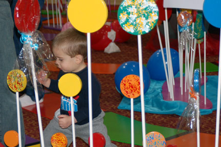 Small Child Playing on the Life-Sized Candy Land B